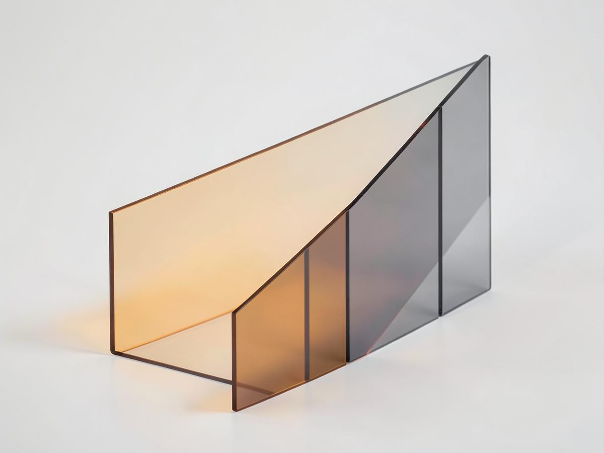 Layered amber and grey glass panels representing a diversified portfolio